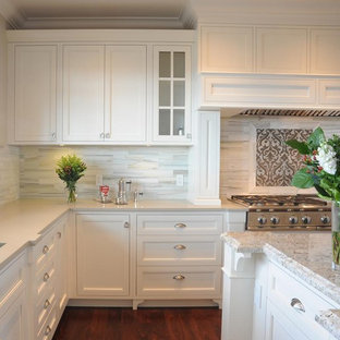 Large transitional eat-in kitchen ideas - Inspiration for a large transitional u-shaped medium tone wood floor eat-in kitchen remodel in Vancouver with quartz countertops, beaded inset cabinets, white cabinets, an island, an undermount sink, white backsplash, stone tile backsplash and stainless steel appliances