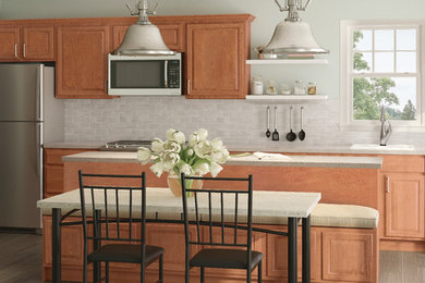 Inspiration for a kitchen remodel in Detroit with raised-panel cabinets and light wood cabinets