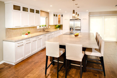Inspiration for a mid-sized galley open concept kitchen remodel in San Diego with flat-panel cabinets and an island