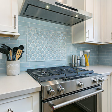 Coastal Kitchen Remodel with Blue Tile Backsplash and White Cabinets