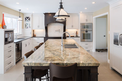 Example of a ceramic tile and beige floor kitchen design in Ottawa with white cabinets, quartzite countertops, multicolored backsplash, stainless steel appliances and an island
