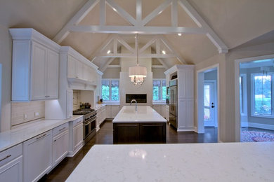 Carmel White Kitchen Renovation with Vaulted and Beamed Ceiling