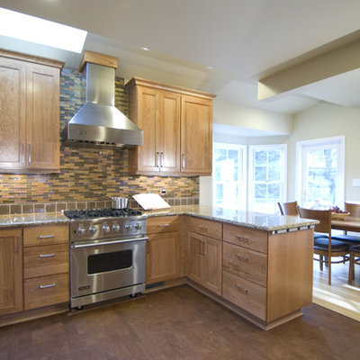 Elegant eat-in kitchen photo in DC Metro with shaker cabinets, medium tone wood cabinets and multicolored backsplash