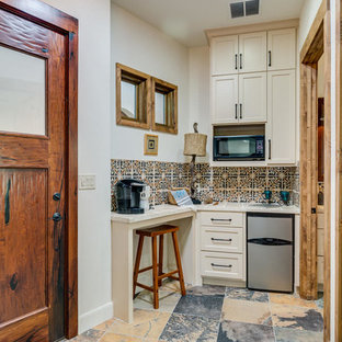 Photo of a small transitional single-wall separate kitchen in Austin with an integrated sink, white cabinets, multi-coloured floor, multi-coloured splashback, stainless steel appliances, shaker cabinets, tile benchtops, porcelain splashback, slate floors and no island.