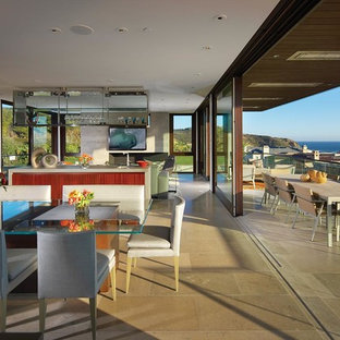 Modern open plan kitchen in Orange County with open cabinets.