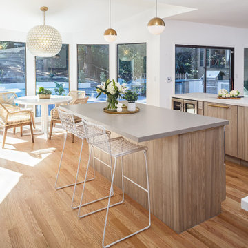 Center island with frameless cabinets, quartz countertop, seating