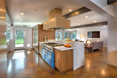 Example of a mid-sized mid-century modern galley concrete floor eat-in kitchen design in Sacramento with a farmhouse sink, glass-front cabinets, medium tone wood cabinets, quartz countertops, stainless steel appliances and an island