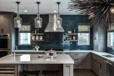Eat-in kitchen - large farmhouse u-shaped light wood floor and brown floor eat-in kitchen idea in Chicago with an undermount sink, recessed-panel cabinets, light wood cabinets, quartz countertops, blue backsplash, subway tile backsplash, stainless steel appliances, an island and white countertops