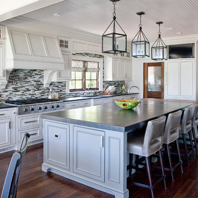 Elegant kitchen photo in Charleston with matchstick tile backsplash, multicolored backsplash, paneled appliances, beaded inset cabinets and white cabinets