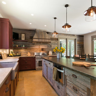 Inspiration for a rustic l-shaped eat-in kitchen remodel in Charleston with a farmhouse sink, shaker cabinets, stainless steel appliances, an island and dark wood cabinets