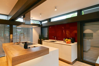 Design ideas for a modern kitchen in Surrey.
