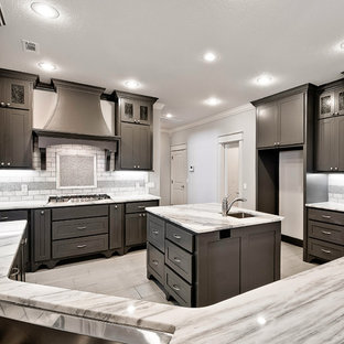 Large transitional kitchen appliance - Example of a large transitional u-shaped gray floor and marble floor kitchen design in Other with shaker cabinets, dark wood cabinets, marble countertops, white backsplash, stone tile backsplash, stainless steel appliances, an island and an undermount sink