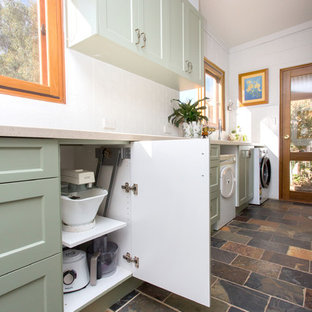 Inspiration for a small country galley kitchen in Other with a double-bowl sink, shaker cabinets, green cabinets, solid surface benchtops, white splashback, metal splashback, slate floors, multi-coloured floor and beige benchtop.