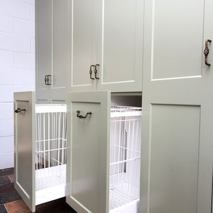 This is an example of a small country galley kitchen in Other with a double-bowl sink, shaker cabinets, green cabinets, solid surface benchtops, white splashback, metal splashback, slate floors, multi-coloured floor and beige benchtop.