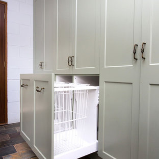 Photo of a small country galley kitchen in Other with a double-bowl sink, shaker cabinets, green cabinets, solid surface benchtops, white splashback, metal splashback, slate floors, multi-coloured floor and beige benchtop.