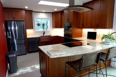 This is an example of a contemporary grey and cream u-shaped kitchen/diner in Charlotte with an island.