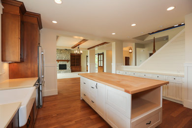 Farmhouse kitchen photo in Other with a farmhouse sink and an island