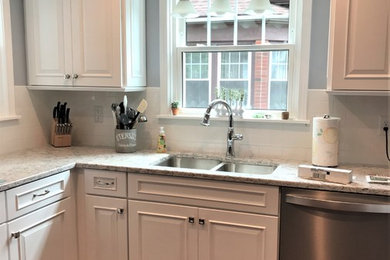 Example of a small classic l-shaped enclosed kitchen design in New York with an undermount sink, white cabinets, quartz countertops, white backsplash and subway tile backsplash