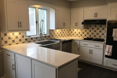 Inspiration for a kitchen remodel in New York with white backsplash and glass tile backsplash