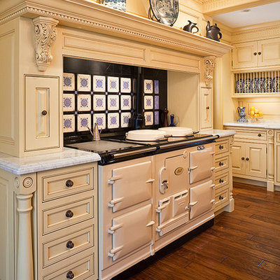 Example of a classic kitchen design in Bridgeport with white appliances and yellow cabinets