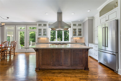 Example of a transitional l-shaped dark wood floor eat-in kitchen design in Raleigh with an undermount sink, recessed-panel cabinets, white cabinets, granite countertops, white backsplash, porcelain backsplash, stainless steel appliances and an island