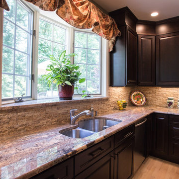Chefs view in this Tuscan kitchen, granite ledge on the bay window