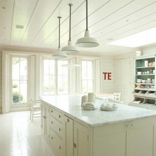 Design ideas for a traditional kitchen in London with open cabinets, distressed cabinets, painted wood floors and with island.
