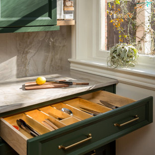 Small transitional l-shaped eat-in kitchen in Louisville with a single-bowl sink, recessed-panel cabinets, green cabinets, quartzite benchtops, grey splashback, stone slab splashback, stainless steel appliances, medium hardwood floors, a peninsula and grey benchtop.