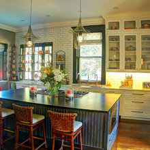green cabinets navy Island with natural counter