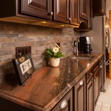Cherry Cabinets, Copper Dune Quartzite counters, stacked stone backsplash, no gr