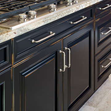 Cherry cabinets with black painted, distressed, island cabinets