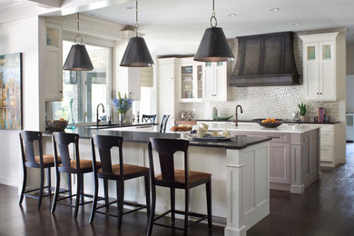 Eat-in kitchen - large transitional u-shaped dark wood floor eat-in kitchen idea in Denver with recessed-panel cabinets, white cabinets, granite countertops, white backsplash, stone tile backsplash and an island