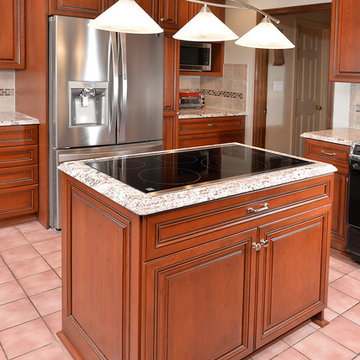 Cherry Kitchen with Cooktop Island in Manassas, VA