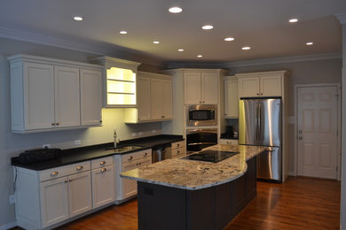 Example of a transitional l-shaped kitchen design in Other