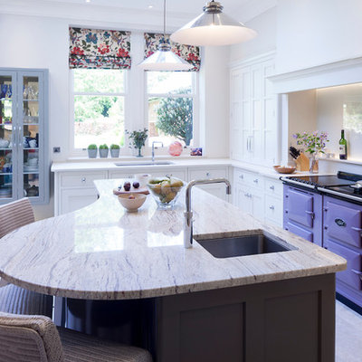 Example of a mid-sized transitional galley beige floor eat-in kitchen design in Cheshire with an undermount sink, shaker cabinets, white cabinets, colored appliances, an island and beige countertops