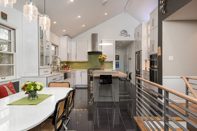 Inspiration for a mid-sized contemporary u-shaped eat-in kitchen remodel in Other with an undermount sink, flat-panel cabinets, quartzite countertops, green backsplash, glass tile backsplash, stainless steel appliances and an island