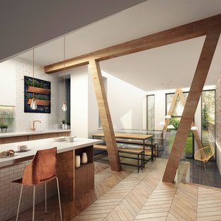 Inspiration for a scandinavian kitchen in Manchester with flat-panel cabinets, light wood cabinets, limestone benchtops and light hardwood floors.