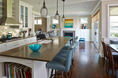 Inspiration for a transitional kitchen remodel in Minneapolis with an undermount sink, flat-panel cabinets, white cabinets and quartz countertops