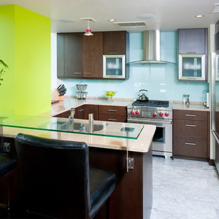 Photo of a small contemporary u-shaped eat-in kitchen in Other with an undermount sink, flat-panel cabinets, medium wood cabinets, blue splashback, stainless steel appliances, marble floors, a peninsula, recycled glass benchtops and glass sheet splashback.
