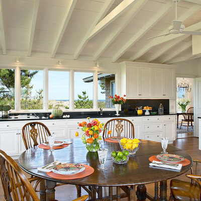 Inspiration for a timeless l-shaped eat-in kitchen remodel in New York with paneled appliances, beaded inset cabinets and white cabinets