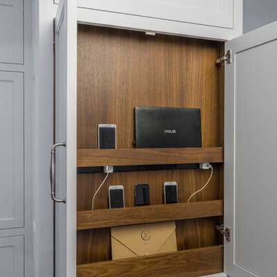 Inspiration for a mid-sized transitional l-shaped dark wood floor and brown floor enclosed kitchen remodel in Boston with an integrated sink, recessed-panel cabinets, white cabinets, soapstone countertops, multicolored backsplash, porcelain backsplash, stainless steel appliances and an island