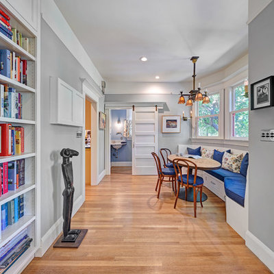 Inspiration for a large timeless u-shaped medium tone wood floor and beige floor open concept kitchen remodel in Sacramento with an undermount sink, recessed-panel cabinets, white cabinets, soapstone countertops, white backsplash, marble backsplash, stainless steel appliances, an island and black countertops