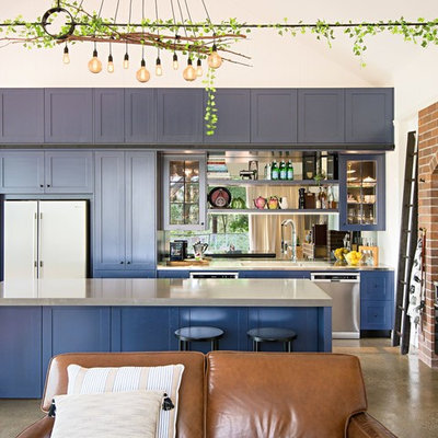 Eclectic l-shaped concrete floor and gray floor open concept kitchen photo in Brisbane with shaker cabinets, blue cabinets, stainless steel countertops, stainless steel appliances and an island