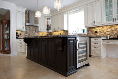 Inspiration for a large timeless u-shaped eat-in kitchen remodel in Toronto with an undermount sink, raised-panel cabinets, white cabinets and granite countertops