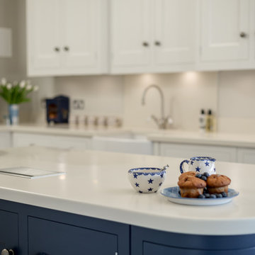 Classic kitchen in pale grey with navy accents