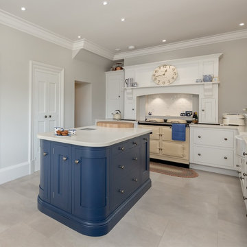 Classic kitchen in pale grey with navy accents