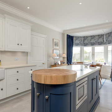 Classic kitchen in pale grey with navy accents