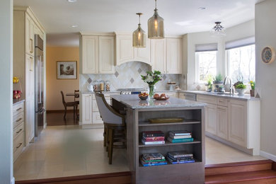 Example of a mid-sized trendy u-shaped porcelain tile and beige floor enclosed kitchen design in Denver with an undermount sink, raised-panel cabinets, white cabinets, granite countertops, multicolored backsplash, porcelain backsplash, stainless steel appliances, an island and gray countertops