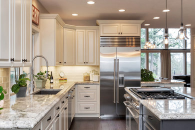 Eat-in kitchen - transitional dark wood floor eat-in kitchen idea in Portland with white backsplash, stainless steel appliances and an island
