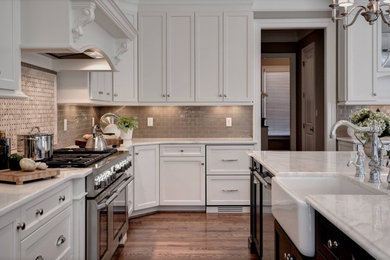 Transitional eat-in kitchen photo in Detroit with shaker cabinets, white cabinets and an island